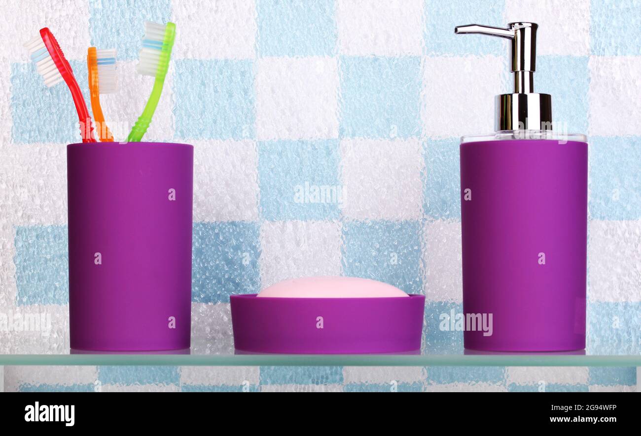 Bath accessories on shelf in bathroom Stock Photo Alamy