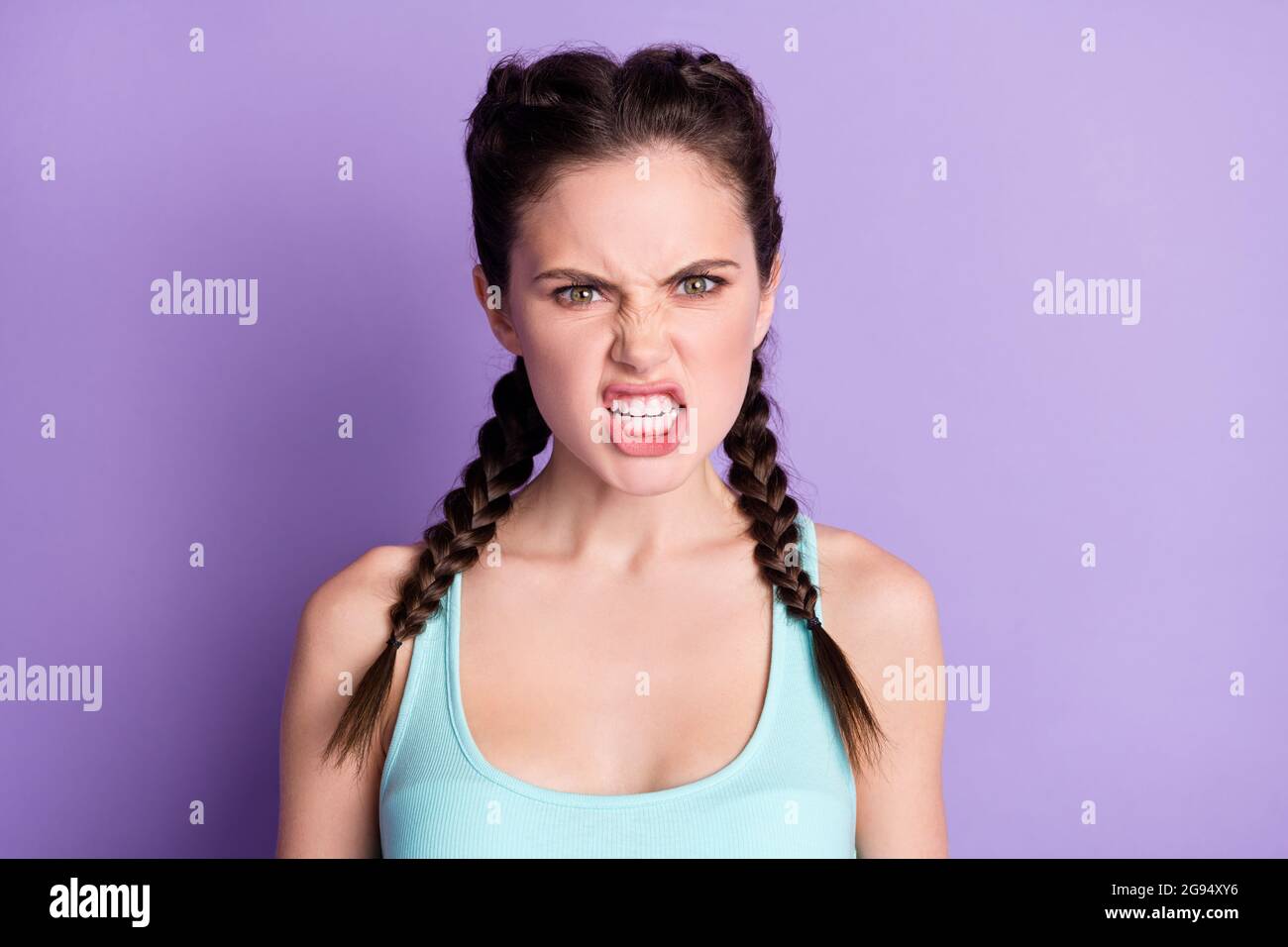 Portrait of attractive outraged evil girl grinning teeth freaking out