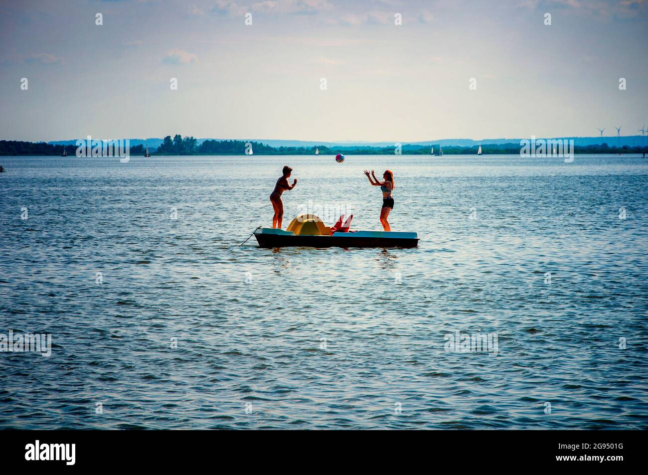 BOHMTE, GERMANY. JUNE 27, 2021 Dammer Natural Park. Lake view, womans playing valleyball. Stock Photo