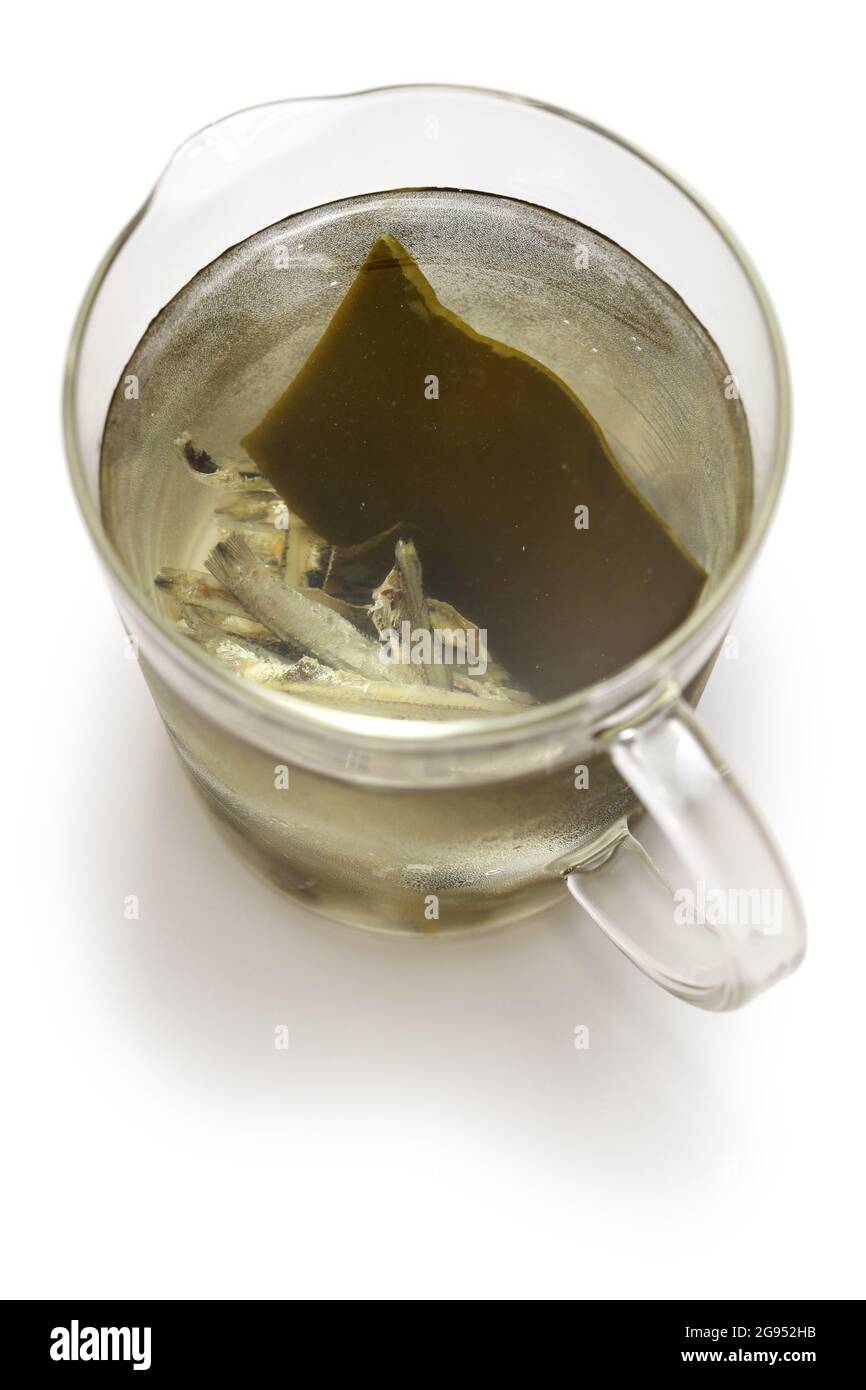 iriko( dried anchovy) and kombu (dried kelp) dashi, japanese basic soup stock in measuring cup Stock Photo