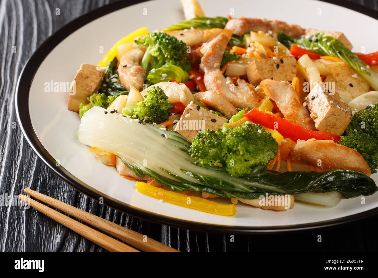 Stir fried of chicken, tofu, bell peppers, carrots, broccoli and bok