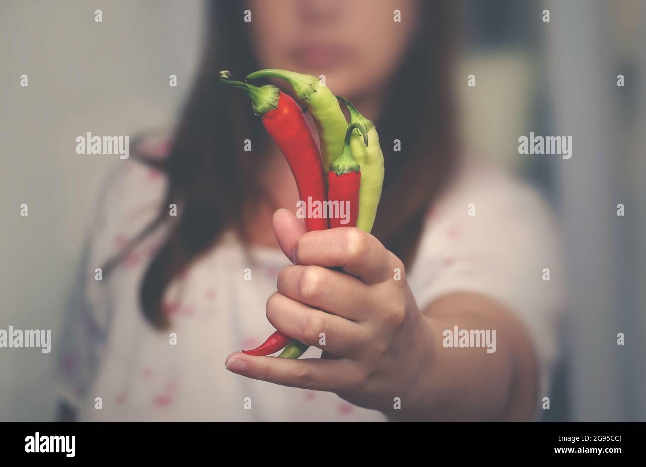 Red hot chili pepper eating woman hi-res stock photography and images ...