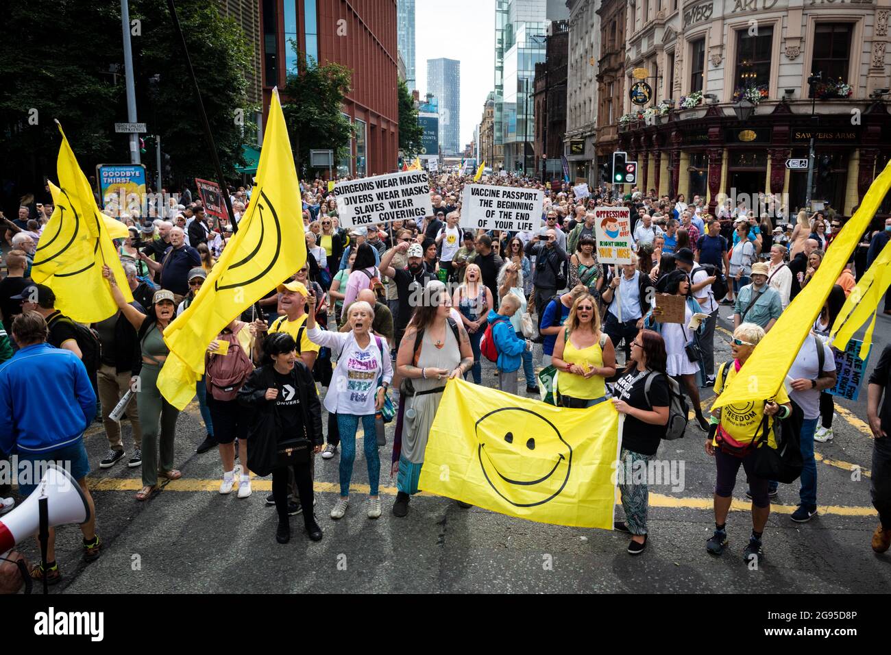 Manchester, UK. 24th July, 2021. Hundreds of protesters against the lockdowns descend on the city. People march through Piccadilly for a global Worldwide Rally For Freedom demonstration. Credit: Andy Barton/Alamy Live News Stock Photo