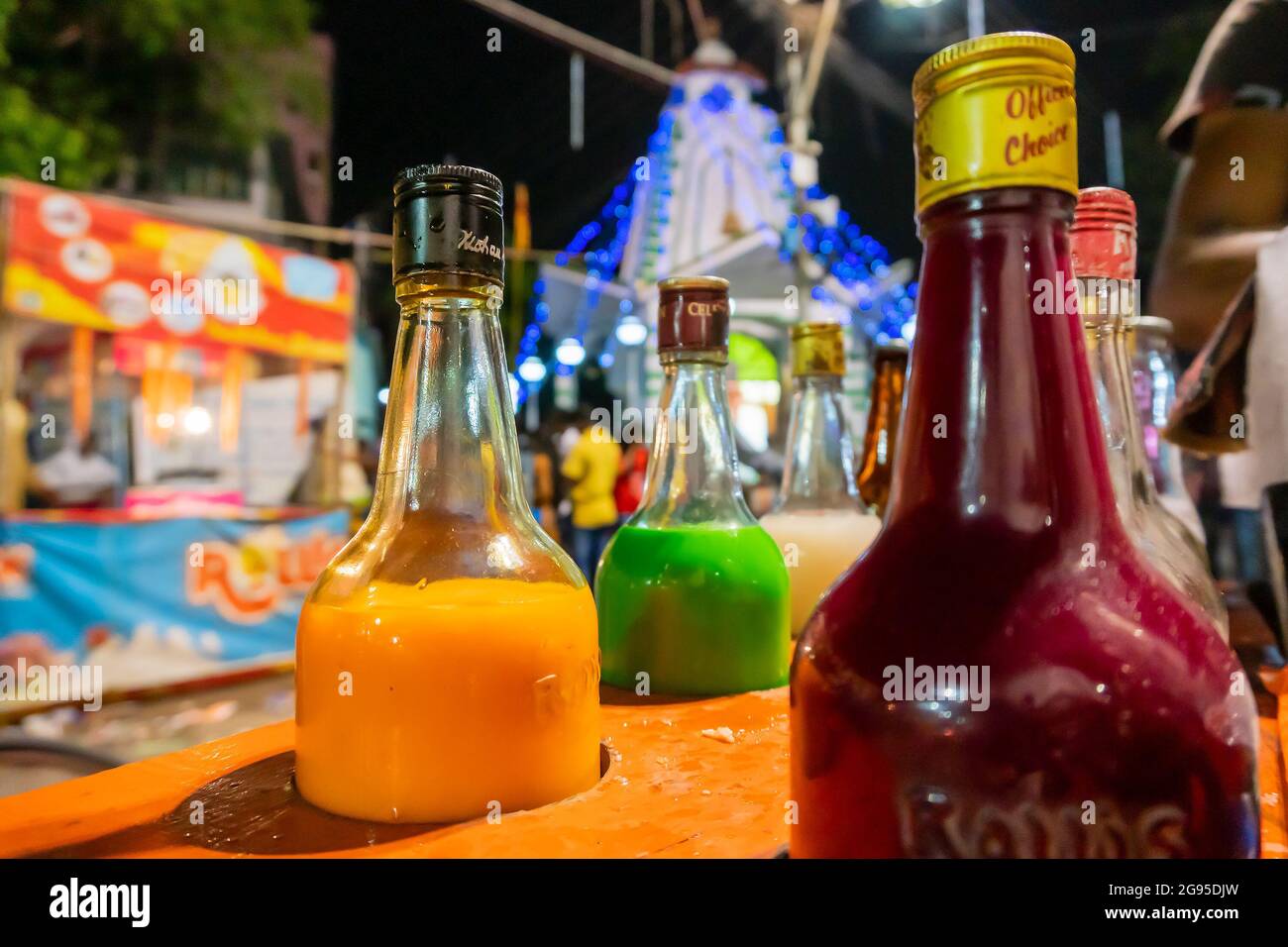 Howrah, West Bengal, India- April 14th 2019 : Colourful juices and syrups for making ice gold or Barf ka gola or chuski or gola ganda, a summer drink. Stock Photo