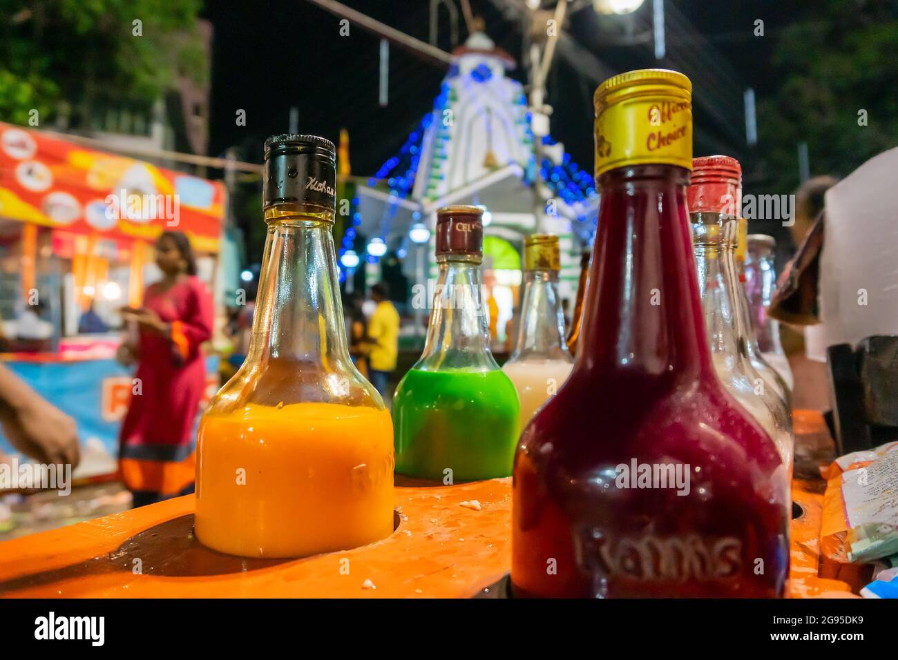 Howrah, West Bengal, India- April 14th 2019 : Colourful juices and syrups for making ice gold or Barf ka gola or chuski or gola ganda, a summer drink. Stock Photo