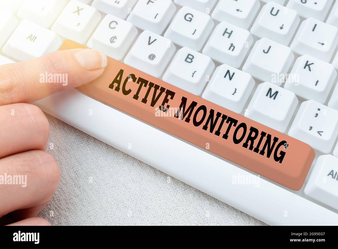 Hand writing sign Active Monitoring. Concept meaning person incharge go