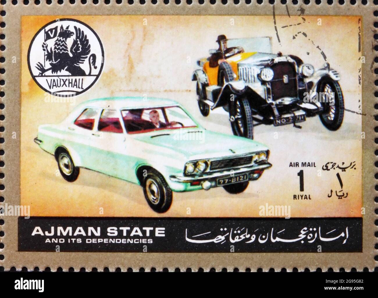 AJMAN - CIRCA 1972: a stamp printed in the Ajman shows Vauxhall, Cars Then and Now, circa 1972 Stock Photo
