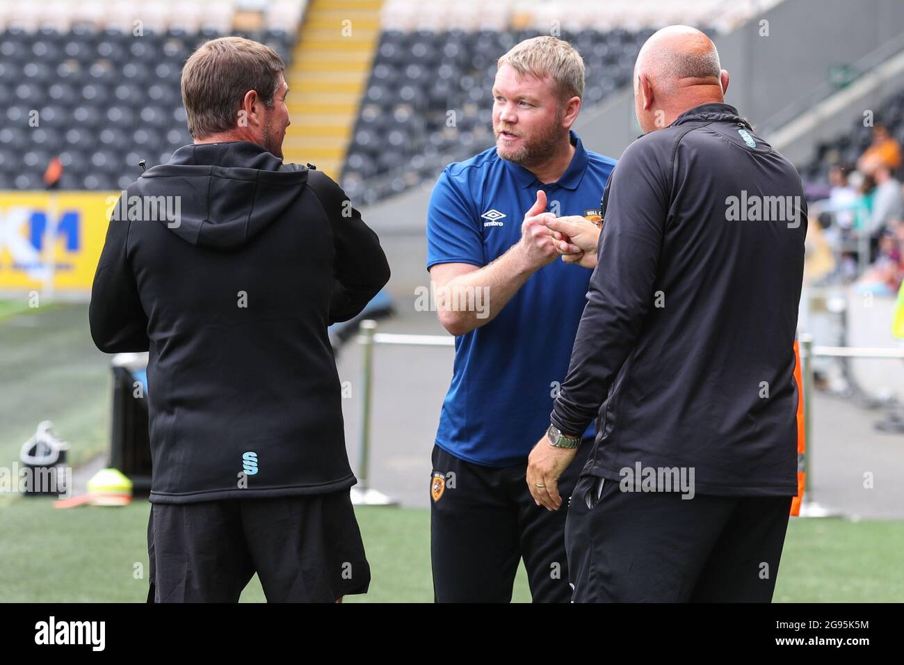Grant McCann manager of Hull City meets Mansfield Town manager Nigel Clough and first team coach Andy Garner prior to the match starting in, on 7/24/2021. (Photo by David Greaves/News Images/Sipa USA) Credit: Sipa USA/Alamy Live News Stock Photo