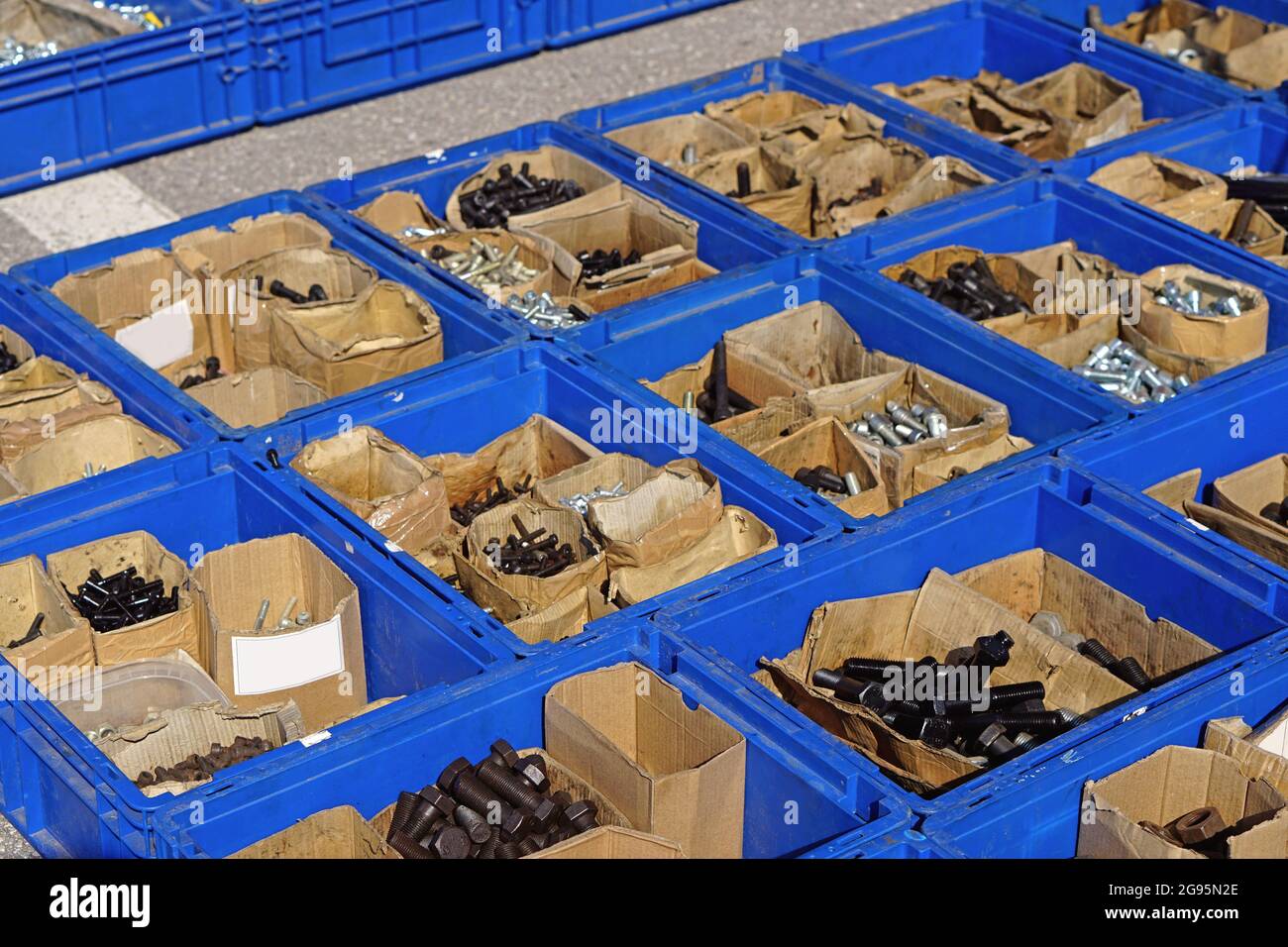 Bolts and nuts in plastic boxes hardware parts Stock Photo Alamy
