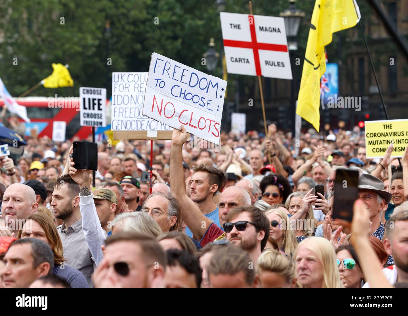 London, UK. 24th July, 2021. Thousands of people gather in Trafalgar Square to protest against the vaccination programme and to celebrate World Freedom Day with events taking place all over the world. Anti-Vaxx demonstration. Westminster. Anti-Vaxx demonstrators demonstrate against the Governments Freedom day and the introduction of vaccine passports. Credit: Mark Thomas/Alamy Live News Stock Photo