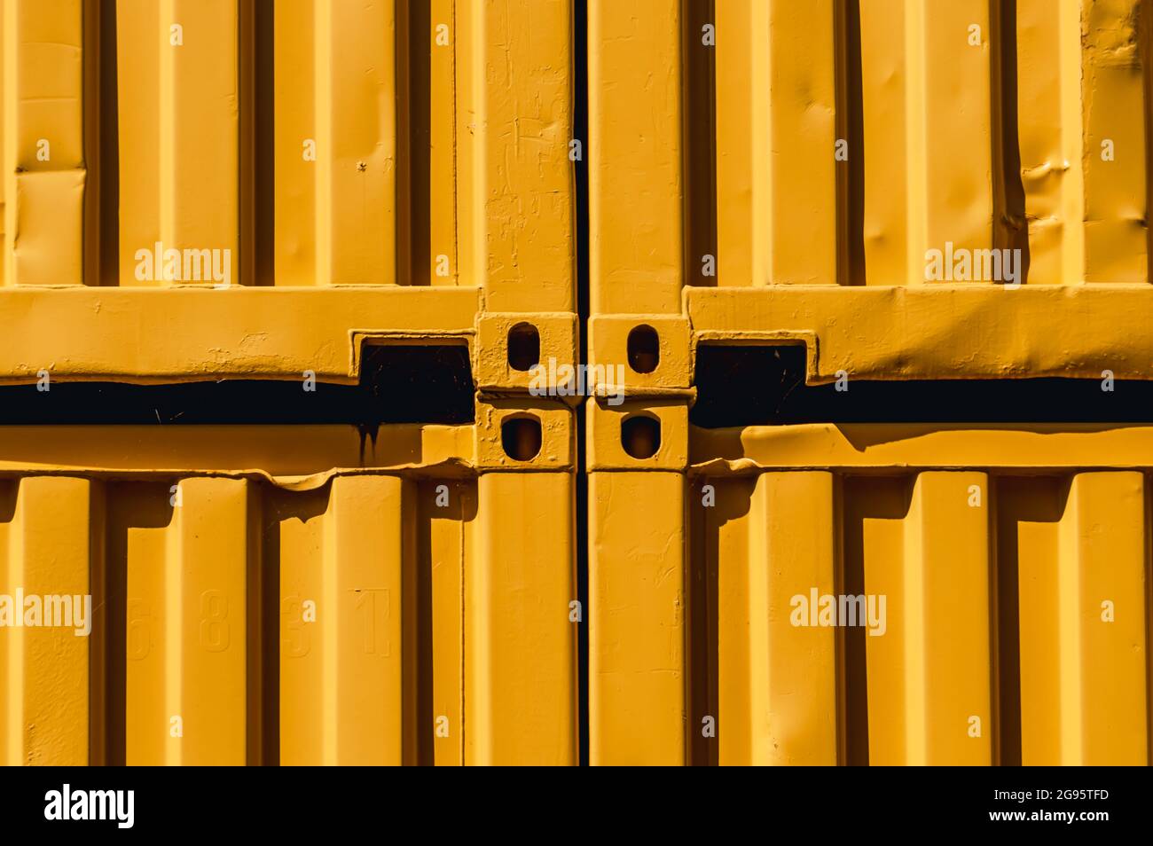 Abstract image of stacked yellow shipping containers in the sunlight Stock Photo