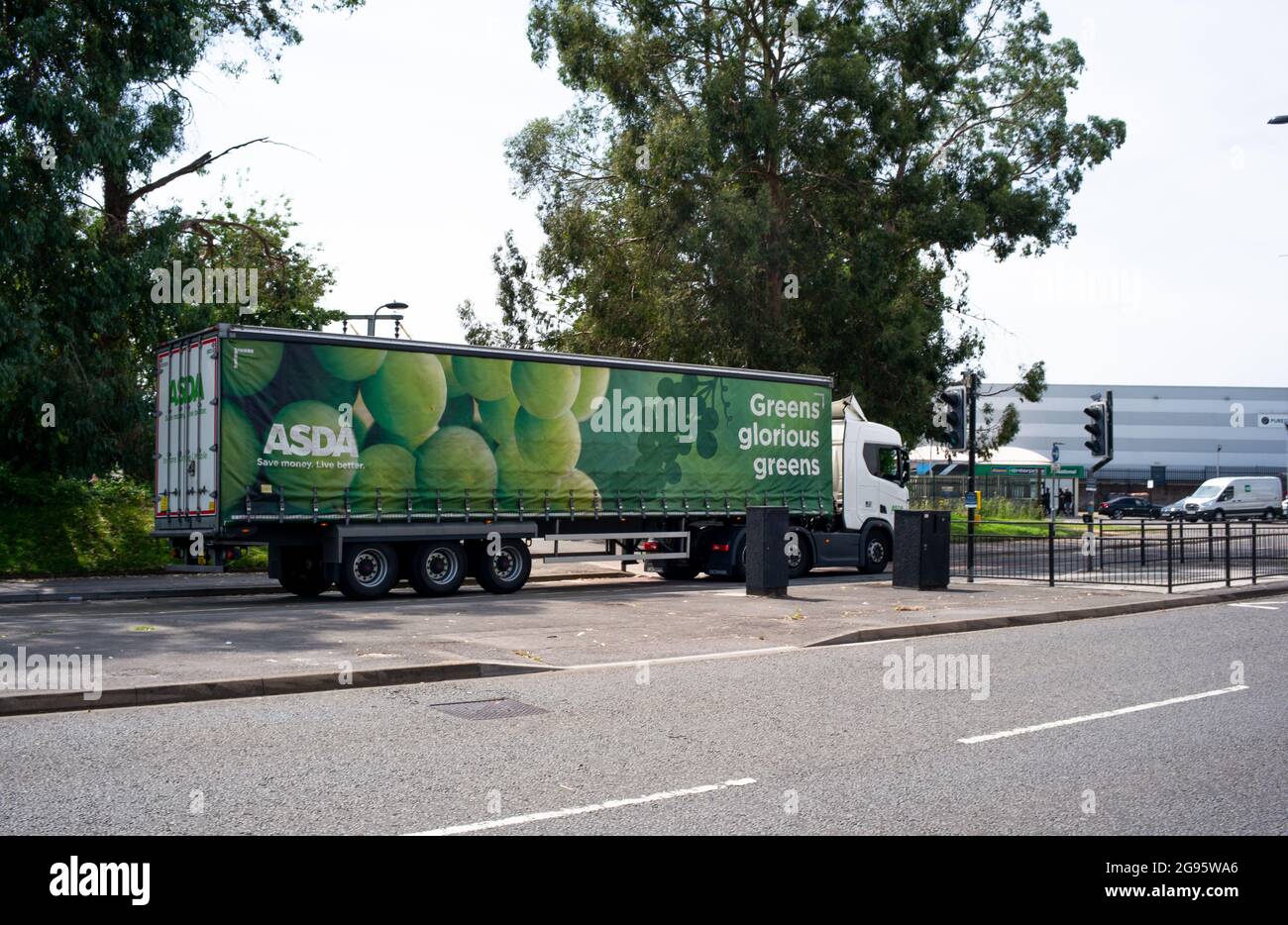 An Asda lorry transporting food goods to supermarkets drives through Southampton after delivering to the city centre superstore. Stock Photo