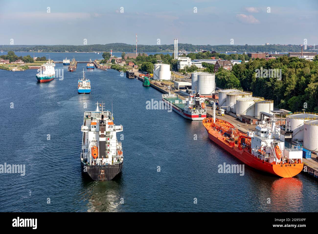 ships in the Kiel canal with Holtenau Locks in the background Stock Photo