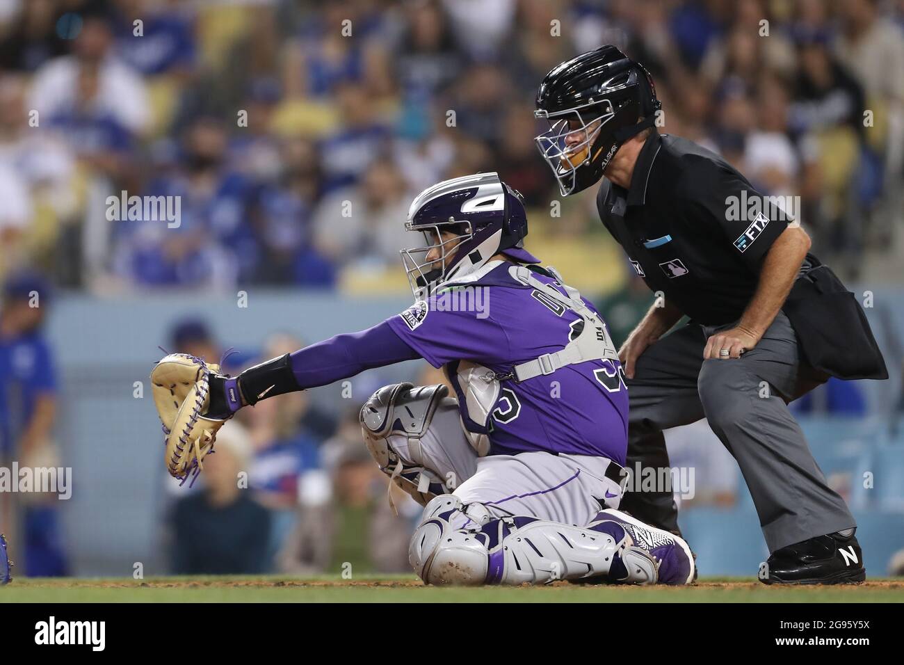 July 23, 2021: Colorado Rockies catcher Elias Diaz (35) catches a pitch behind the plate as home umpire Ed Hickox .(15) looks on during the game between the Colorado Rockies and the Los Angeles Dodgers at Dodger Stadium in Los Angeles, CA. (Photo by Peter Joneleit) Stock Photo