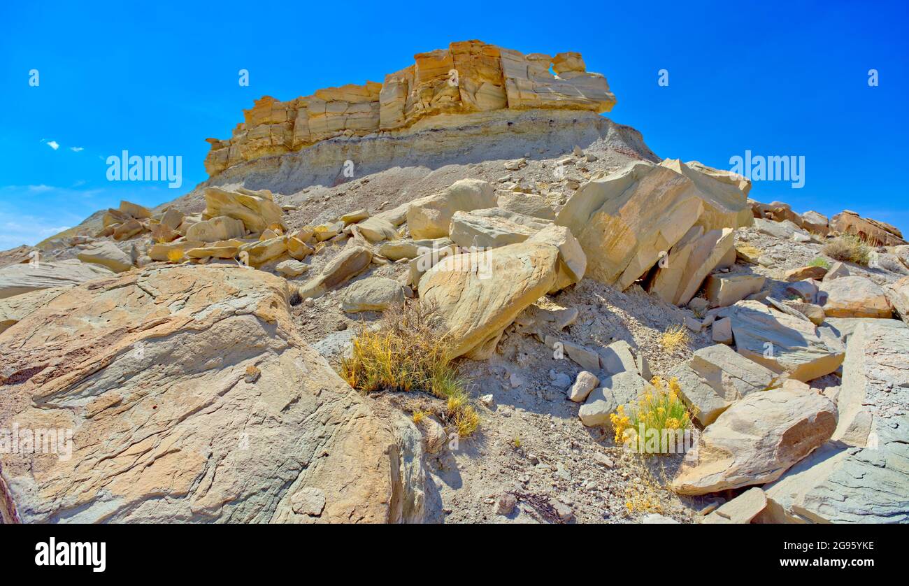 A ridge of leaning rocks in the area of Petrified Forest National Park Arizona called the Flat Tops. Stock Photo