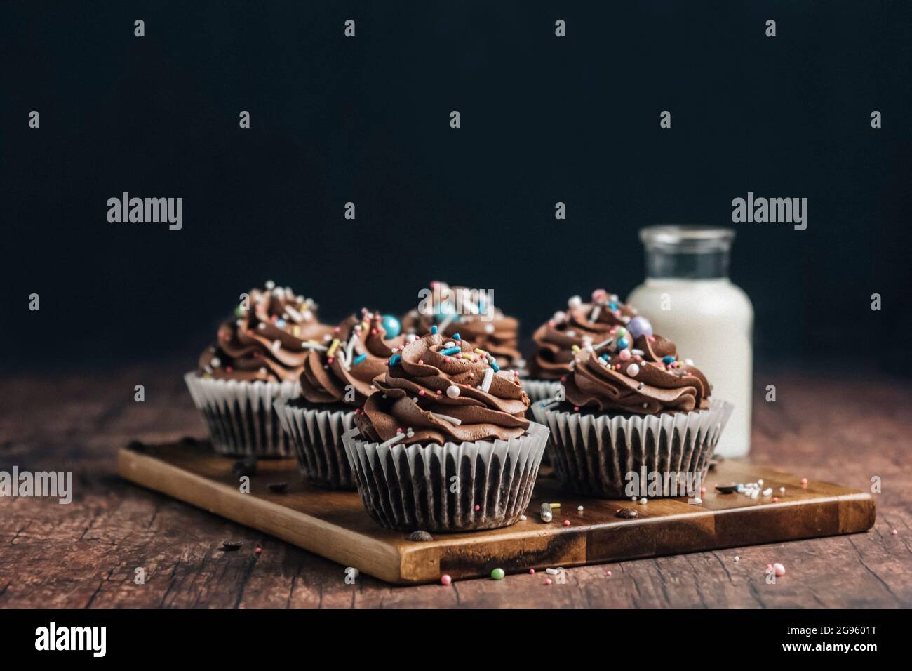 Chocolate cupcakes on a wooden board Stock Photo