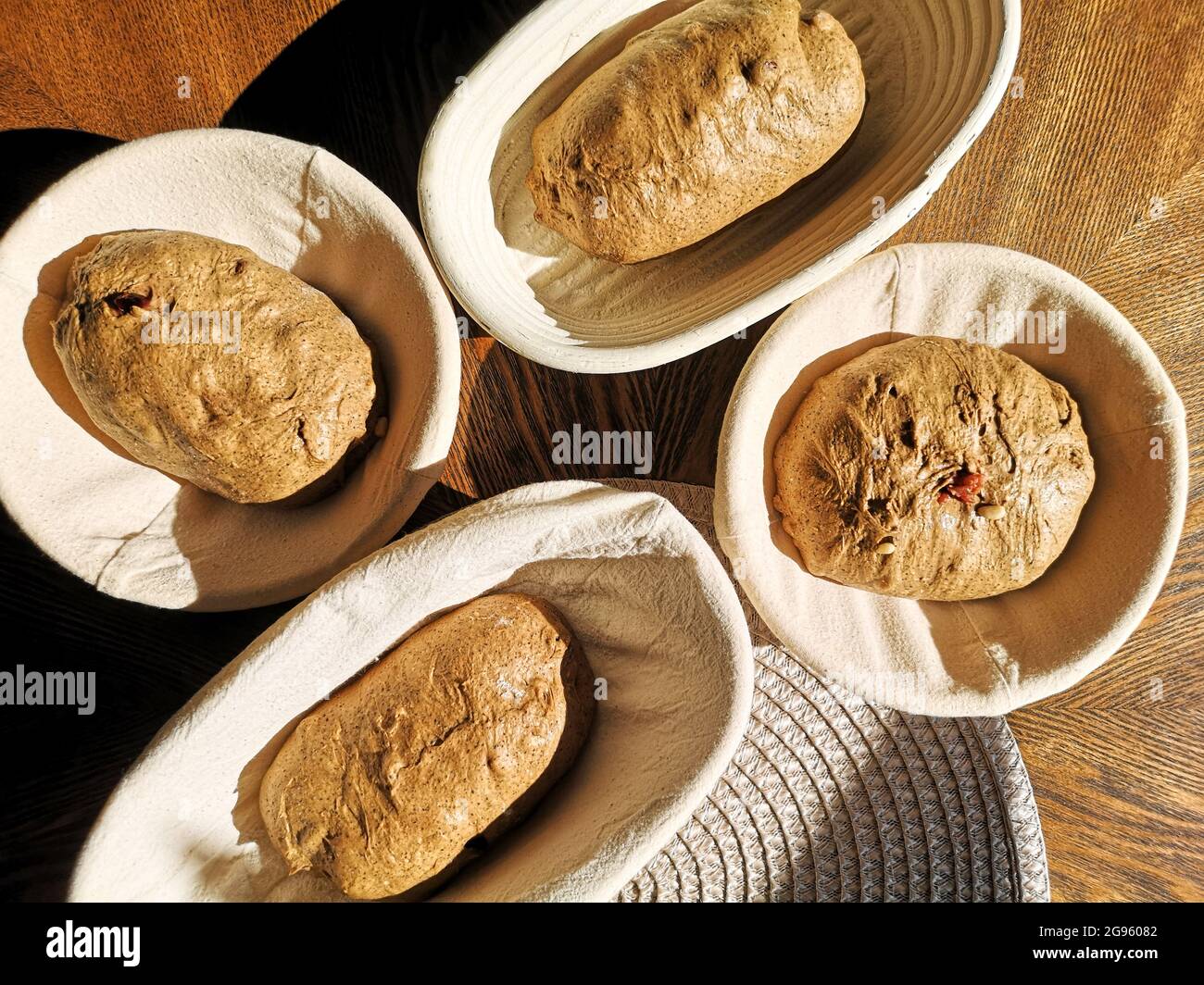 Baking loaf of bread with baskets with wooden rye rye hires stock