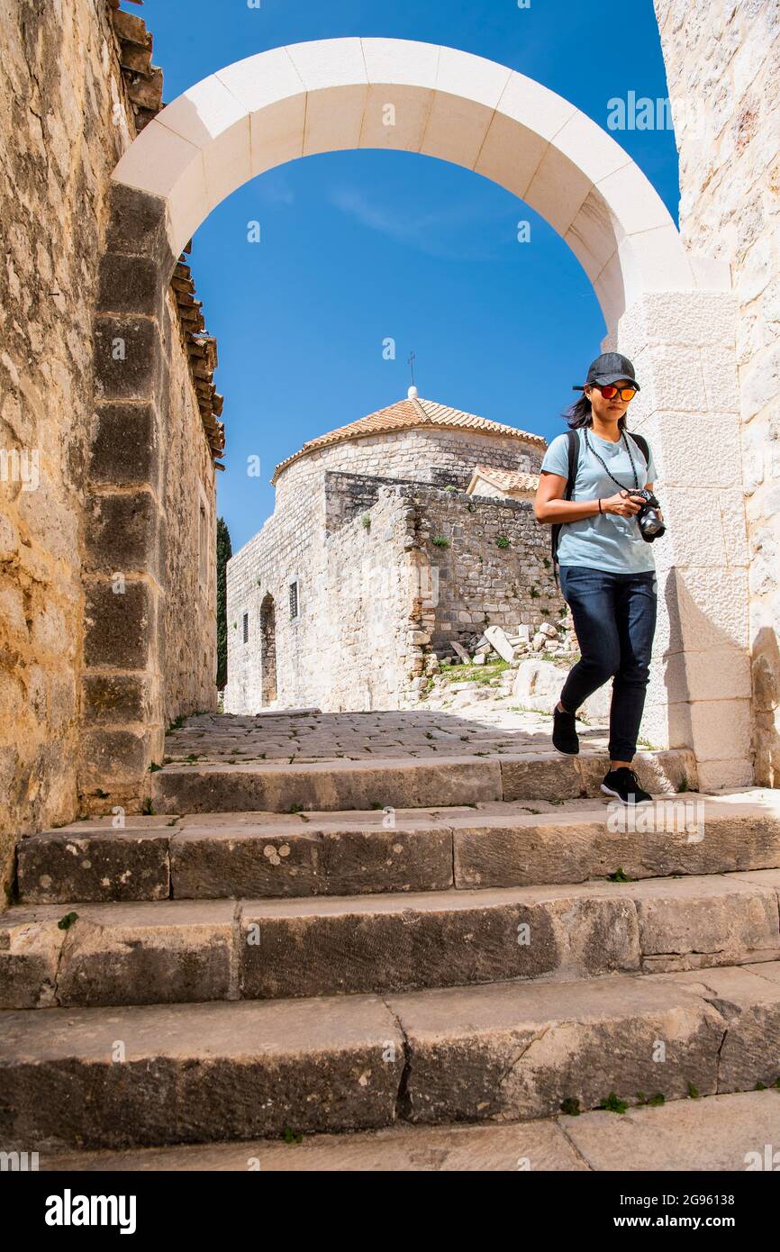 woman exploring the fortress of Klis in Croatia Stock Photo