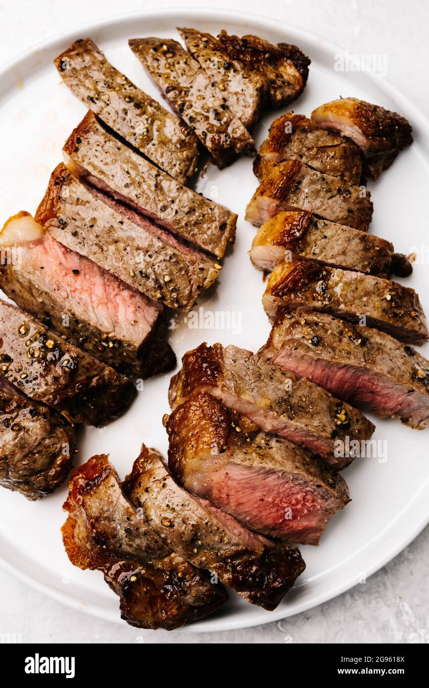 Overhead platter of sliced flat iron steaks Stock Photo Alamy