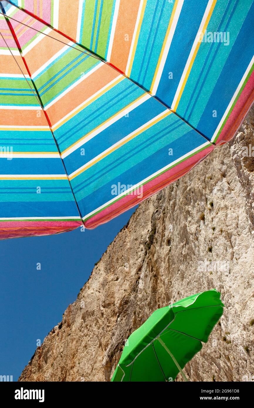 Umbrella protecting from the sun at the beach Stock Photo