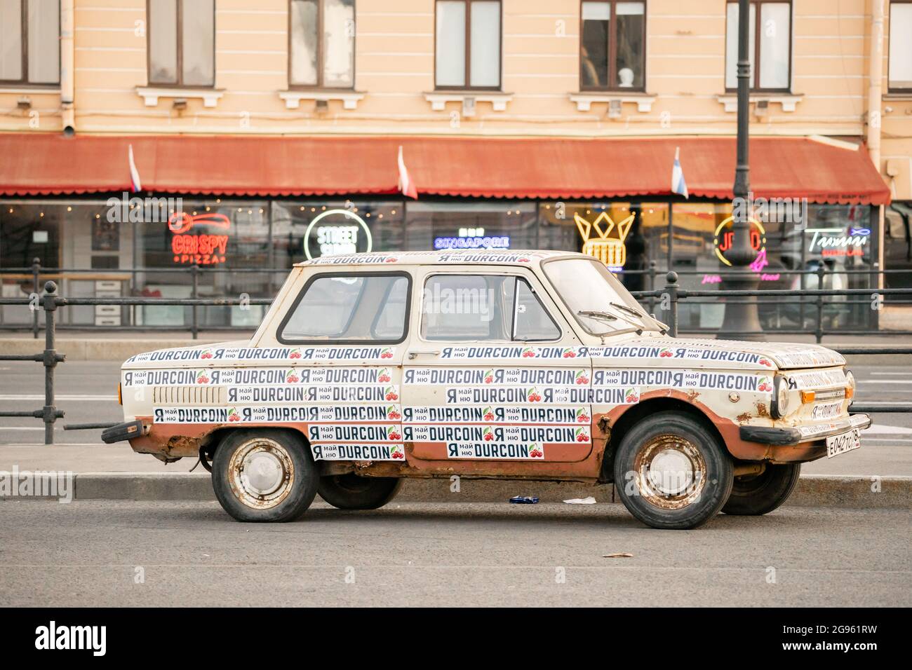 Durcoin cryptocurrency mining promotion stickers pasted on old Zaporozhets  car, St Petersburg, Russia Stock Photo - Alamy