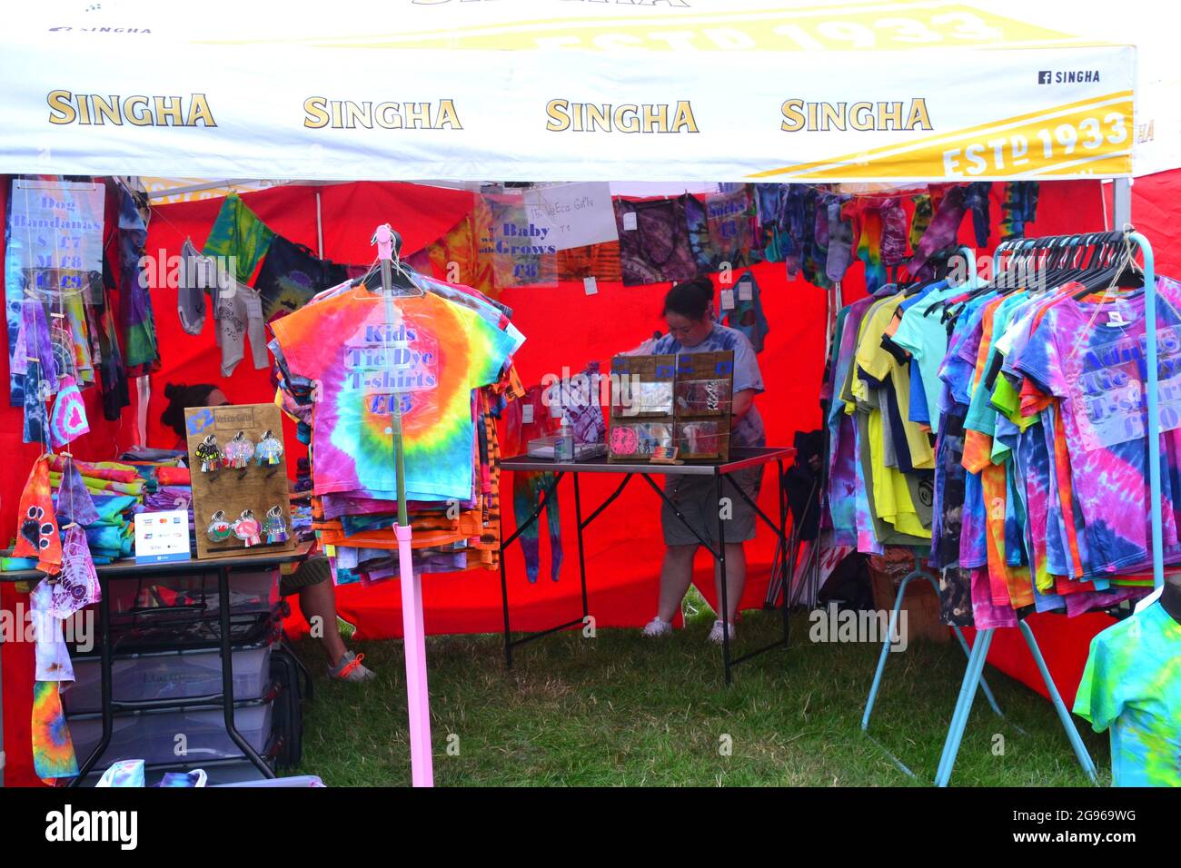 Stalls at the Magic of Thailand Festival at Platt Fields park, Manchester, England, UK, 24th July, 2021,sell products to customers who have paid £4 entrance fee. Festival organisers say:'Treat yourself to a weekend wonder and bring along your families and friends to experience a touch of Thai culture. Thai food, arts and crafts, watch traditional Thai dances, Thai boxing (Muay Thai) demonstrations, ladyboy shows, Thai massage,‘I’m British, Get me out of here’ competition, Thai beer garden and more.' Stock Photo