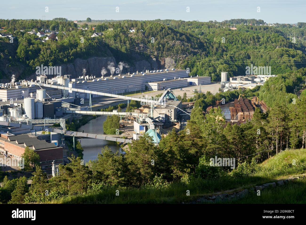 SARPSBORG, NORWAY - Jun 13, 2021: An aerial shot of chemical and paper industry buildings around the Glomma river Stock Photo