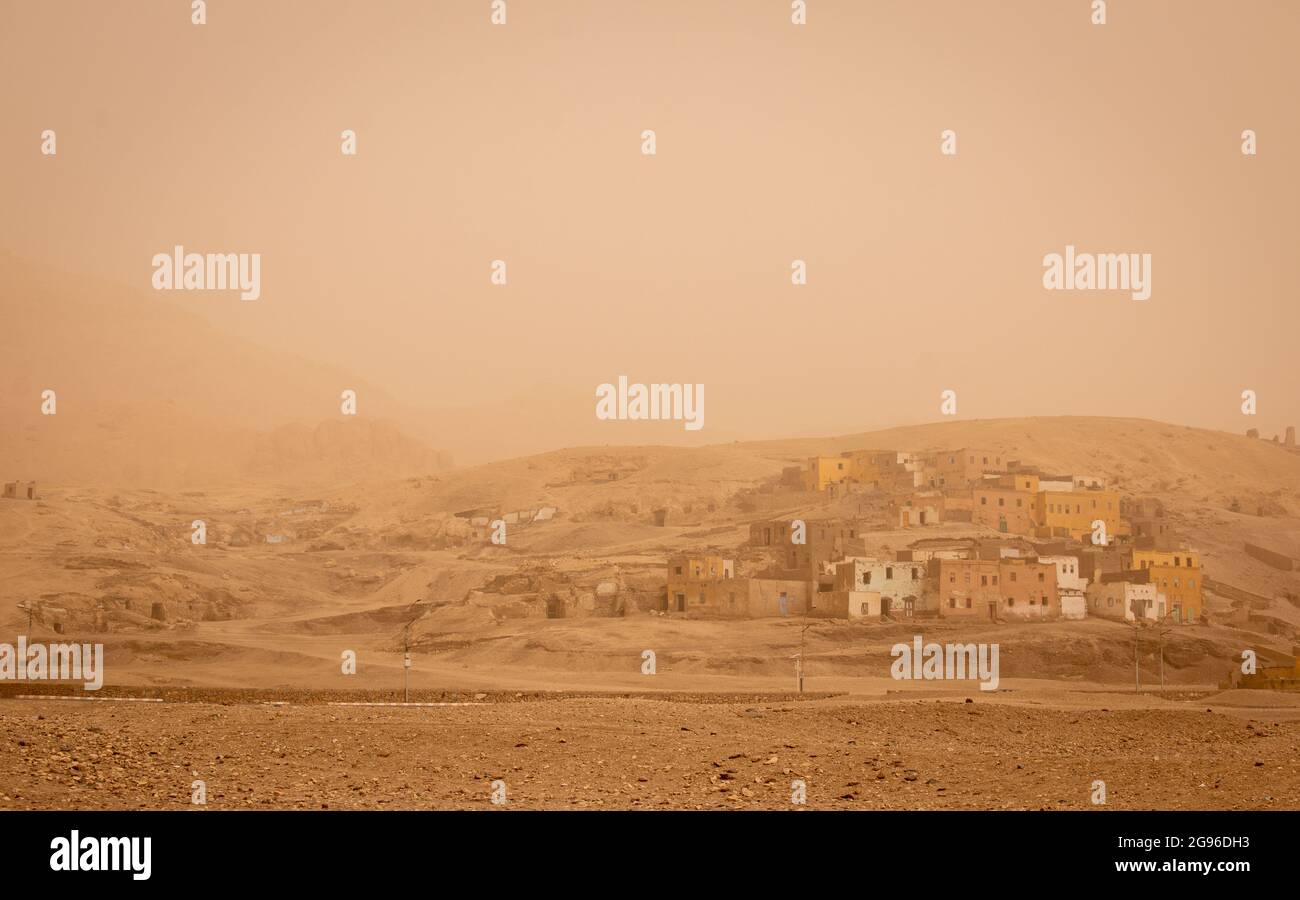 Luxor looking orange early in the morning after a sand storm, Egypt Stock Photo