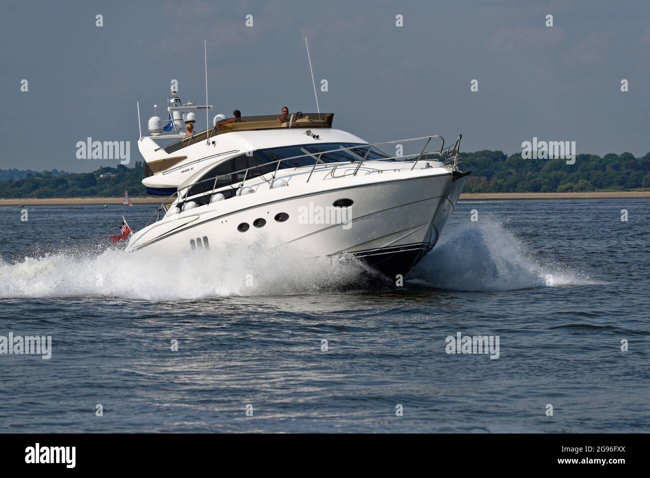 Smart looking Princess 50 Motor Yacht heading along Southampton Water at speed Stock Photo