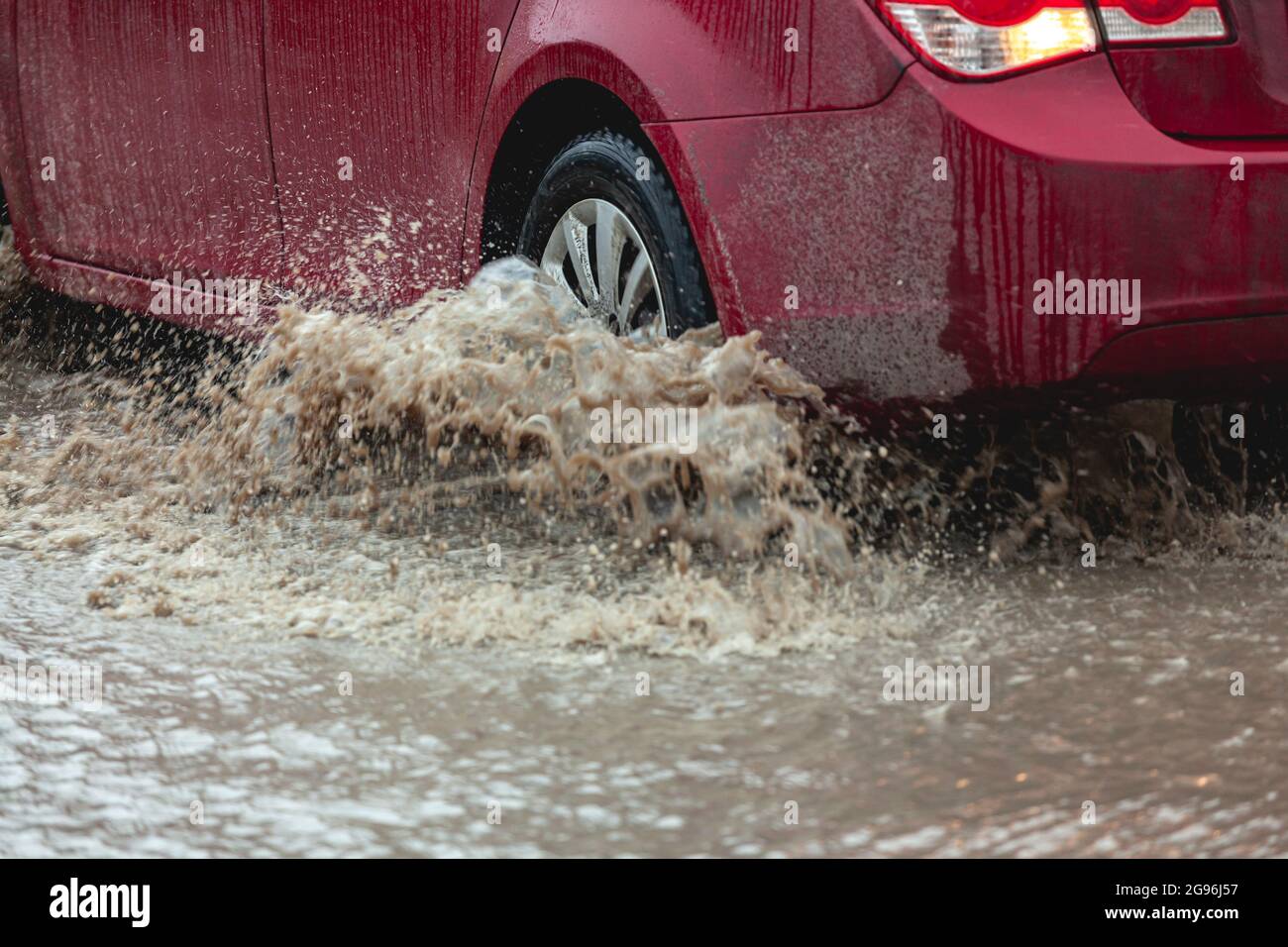 Car stuck in the mud, car wheel in dirty puddle, rough terrain Stock