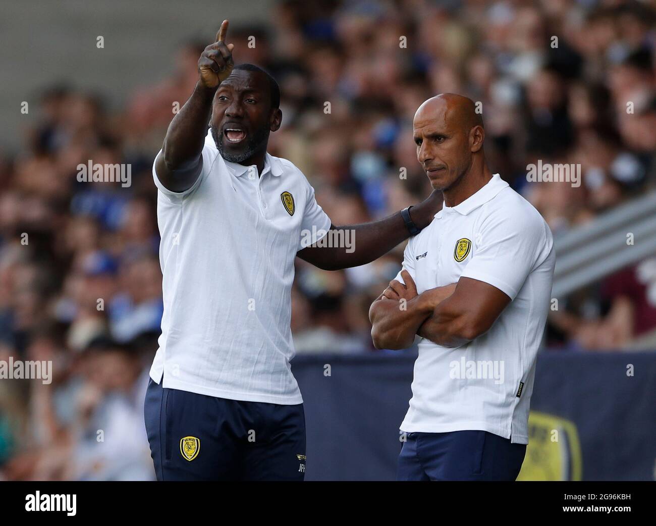 Burton upon Trent, England, 24th July 2021.  Jimmy Floyd Hasselbaink manager of Burton Albion and his assistant Dino Maamria during the Pre Season Friendly match at the Pirelli Stadium, Burton upon Trent. Picture credit should read: Darren Staples / Sportimage Stock Photo