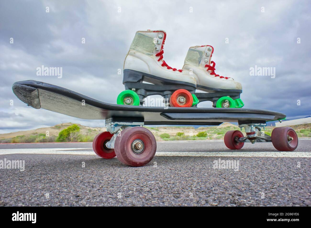 Shot of the skate and roller skates with red and green wheels on it on