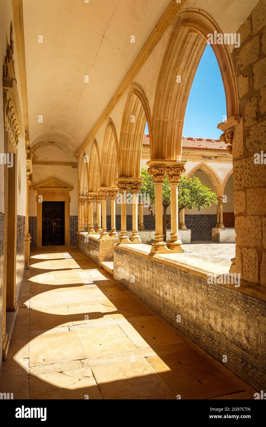 Tomar, Portugal - June 3, 2021: View on a sunny day of the gothic cloister of the cemetery at the Convento de Cristo in Tomar, Portugal. Stock Photo