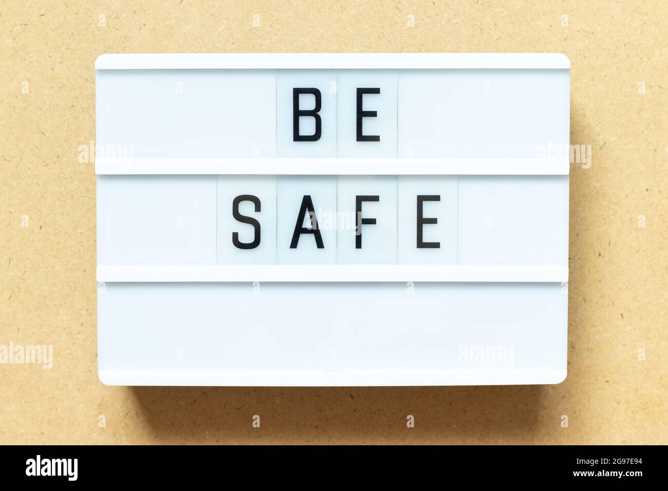 Lightbox with word be safe on wood background Stock Photo