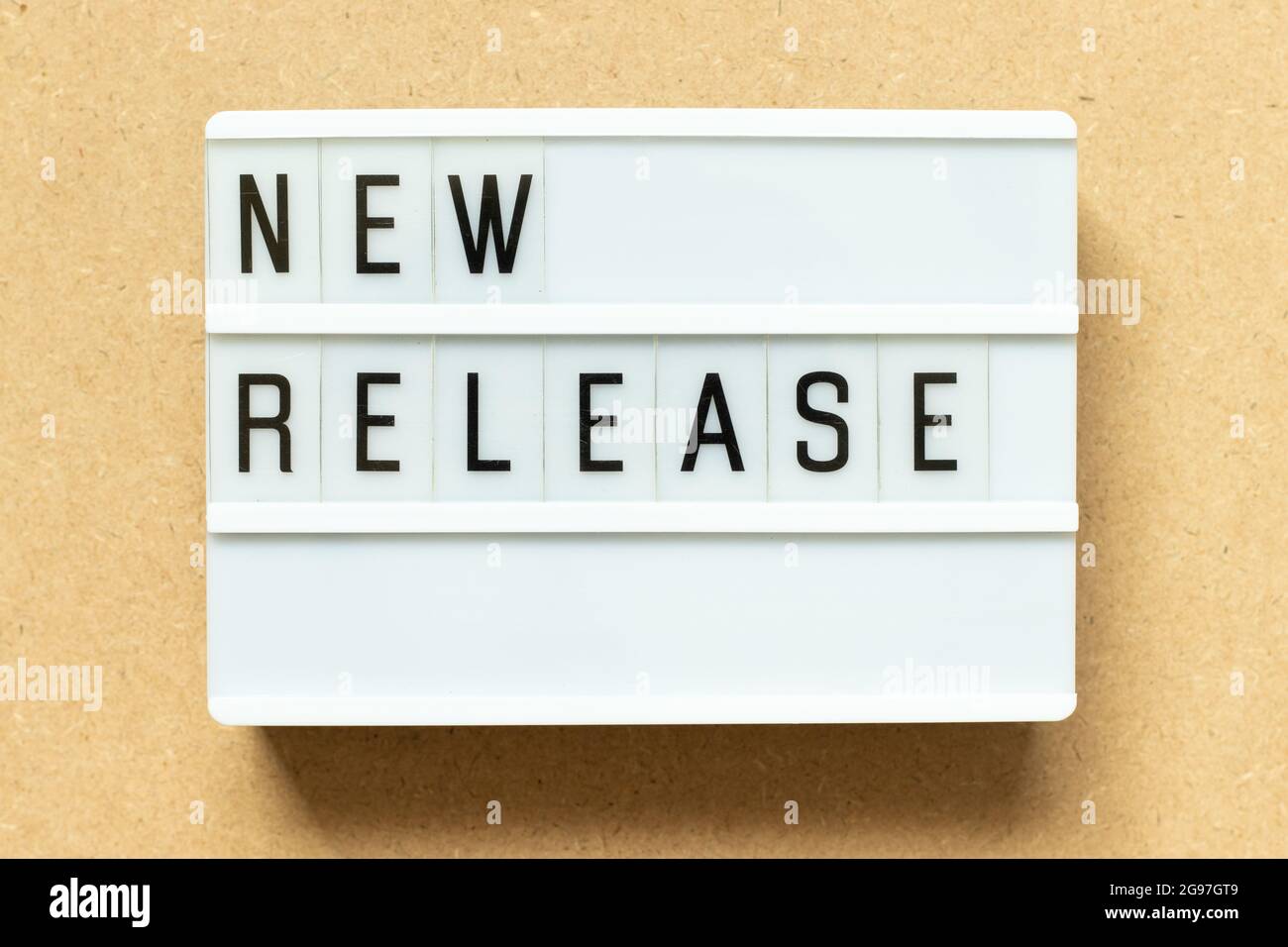 Lightbox with word new release on wood background Stock Photo