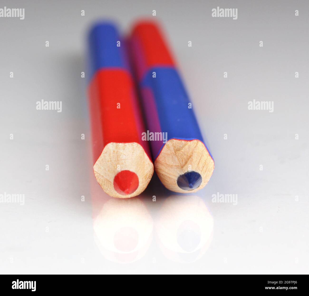 Red and blue pencils closeup isolated on white Stock Photo Alamy