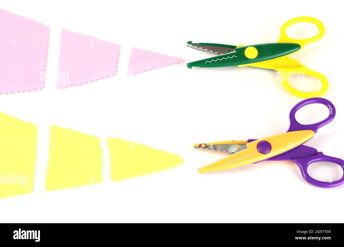 Colorful zigzag scissors with color paper isolated on white Stock Photo -  Alamy