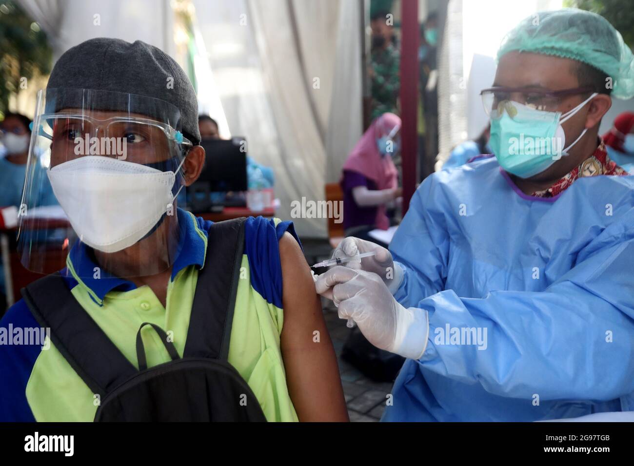 Sidoarjo, Indonesia. 24th July, 2021. A Laborer receives the Sinovac Covid-19 vaccine during a vaccination for Laborer in Sidoarjo, East Java, Indonesia, on July 24, 2021. (Photo by Boy Slamet/INA Photo Agency/Sipa USA) Credit: Sipa USA/Alamy Live News Stock Photo