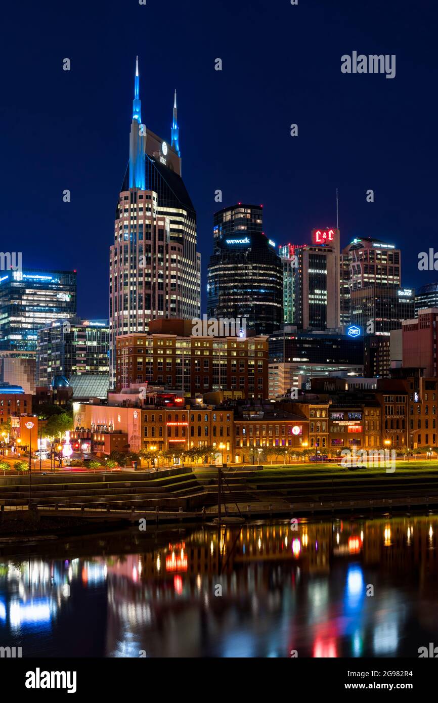 AT&T Building (Batman Building) in Downtown Nashville illuminated at night. View from Cumberland Park, Nashville, Tennessee, USA. Stock Photo