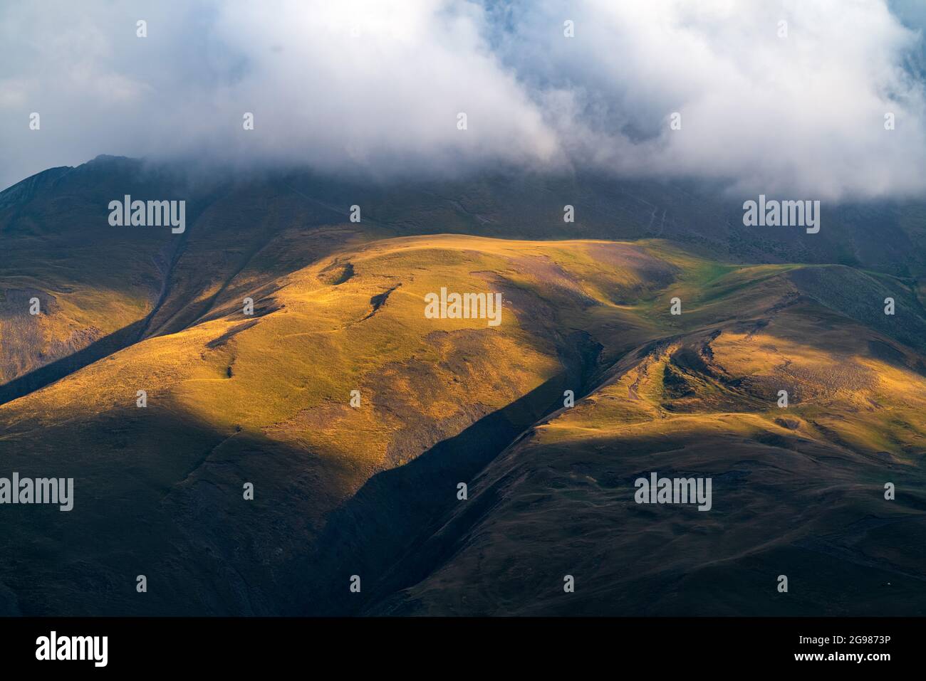 Mountains illuminated by setting sun Stock Photo