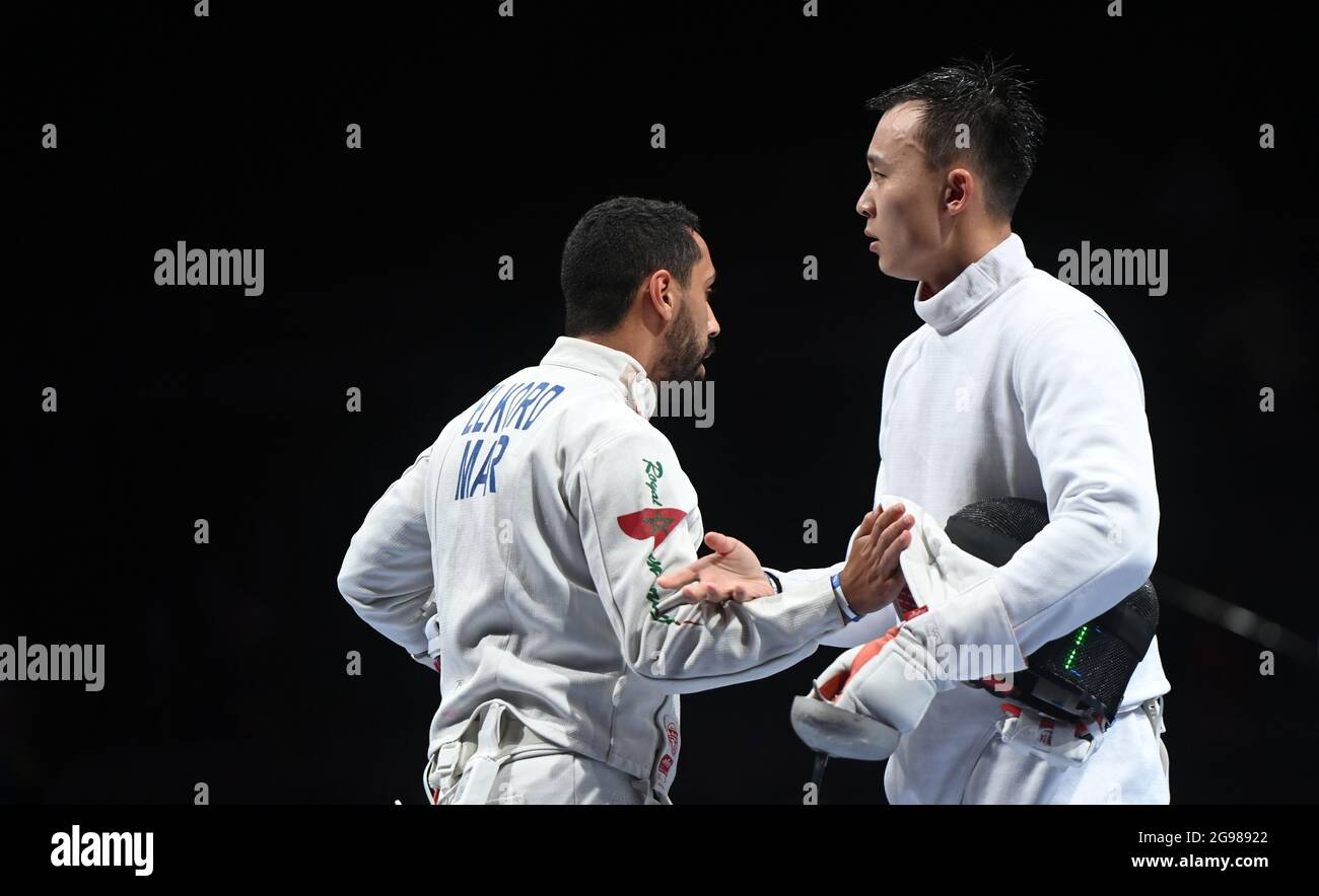 Tokyo. 25th July, 2021. Wang Zijie (R) of China greets Houssam Elkord ...