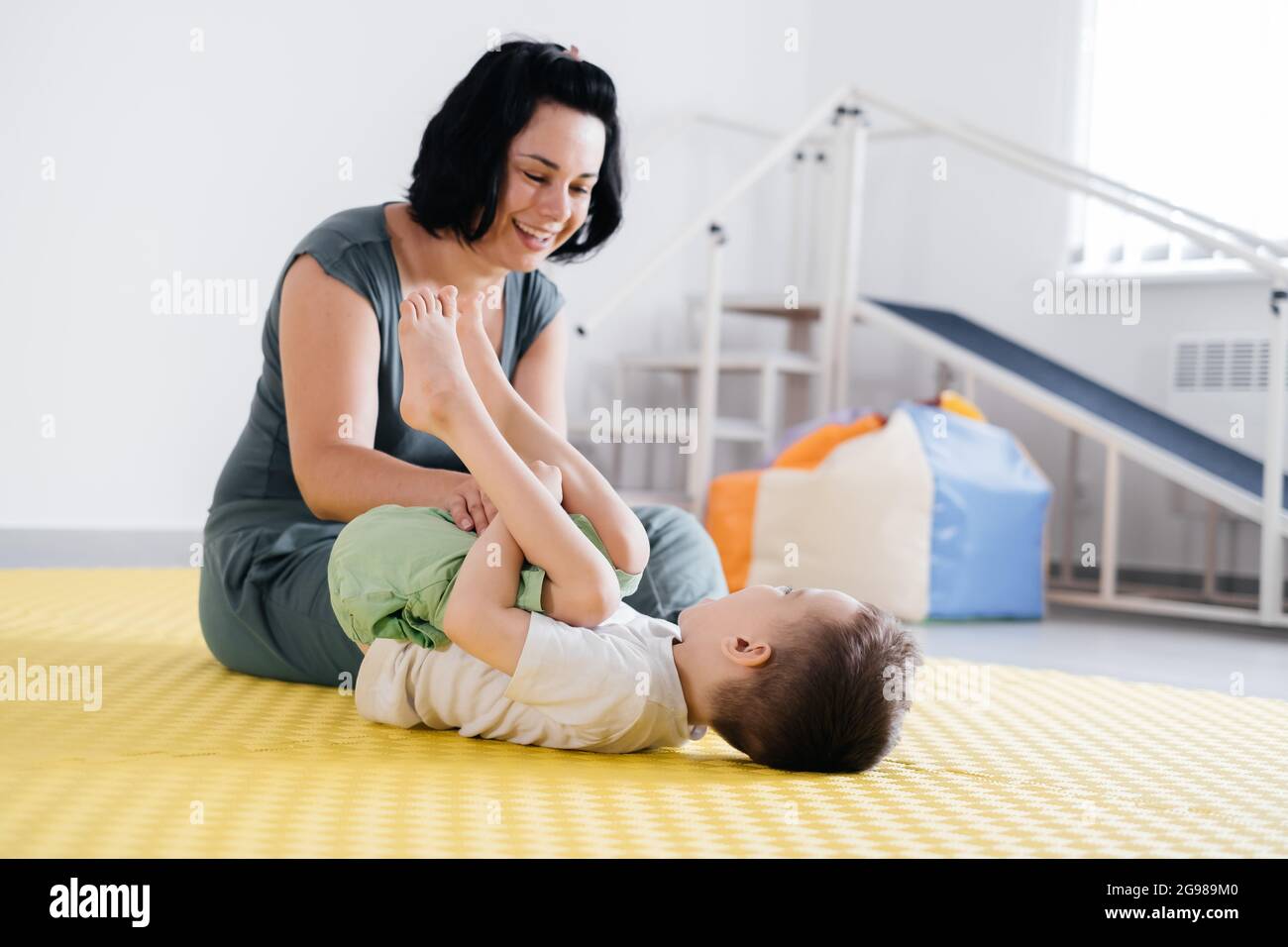 Rehabilitation of child with cerebral palsy in special center. Mother