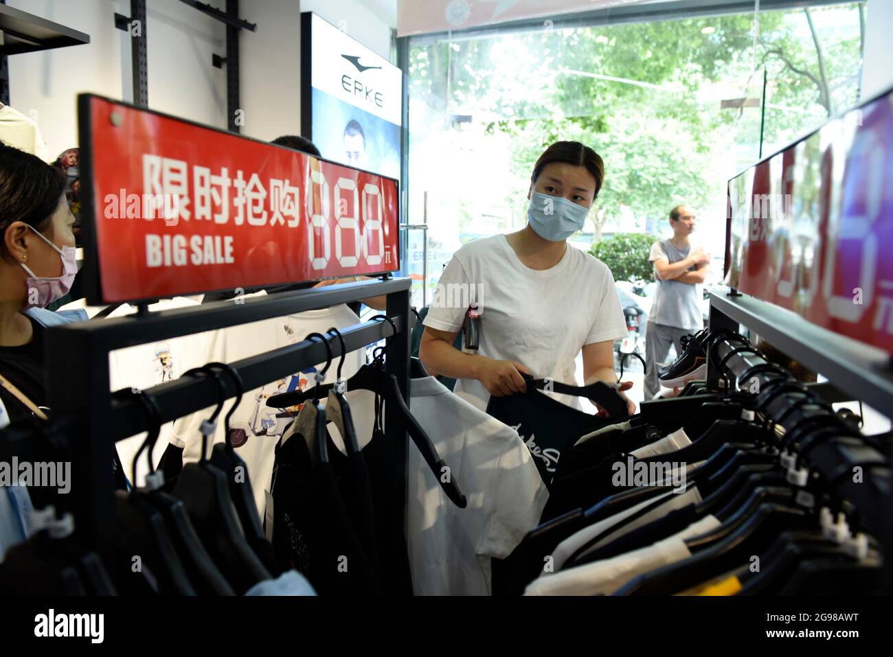 HUAI'AN, CHINA - JULY 25, 2021 - People buy clothes, shoes and hats at a  Erke store on Huaihai North Road in Huai 'an district, East China's Jiangsu  Province, July 25, 2021. (