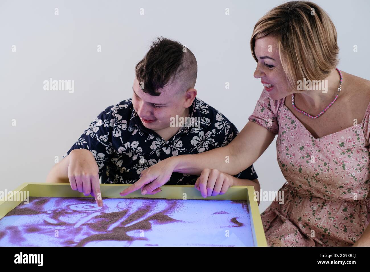 Children with disability getting sensory activity Sand tray, sand table