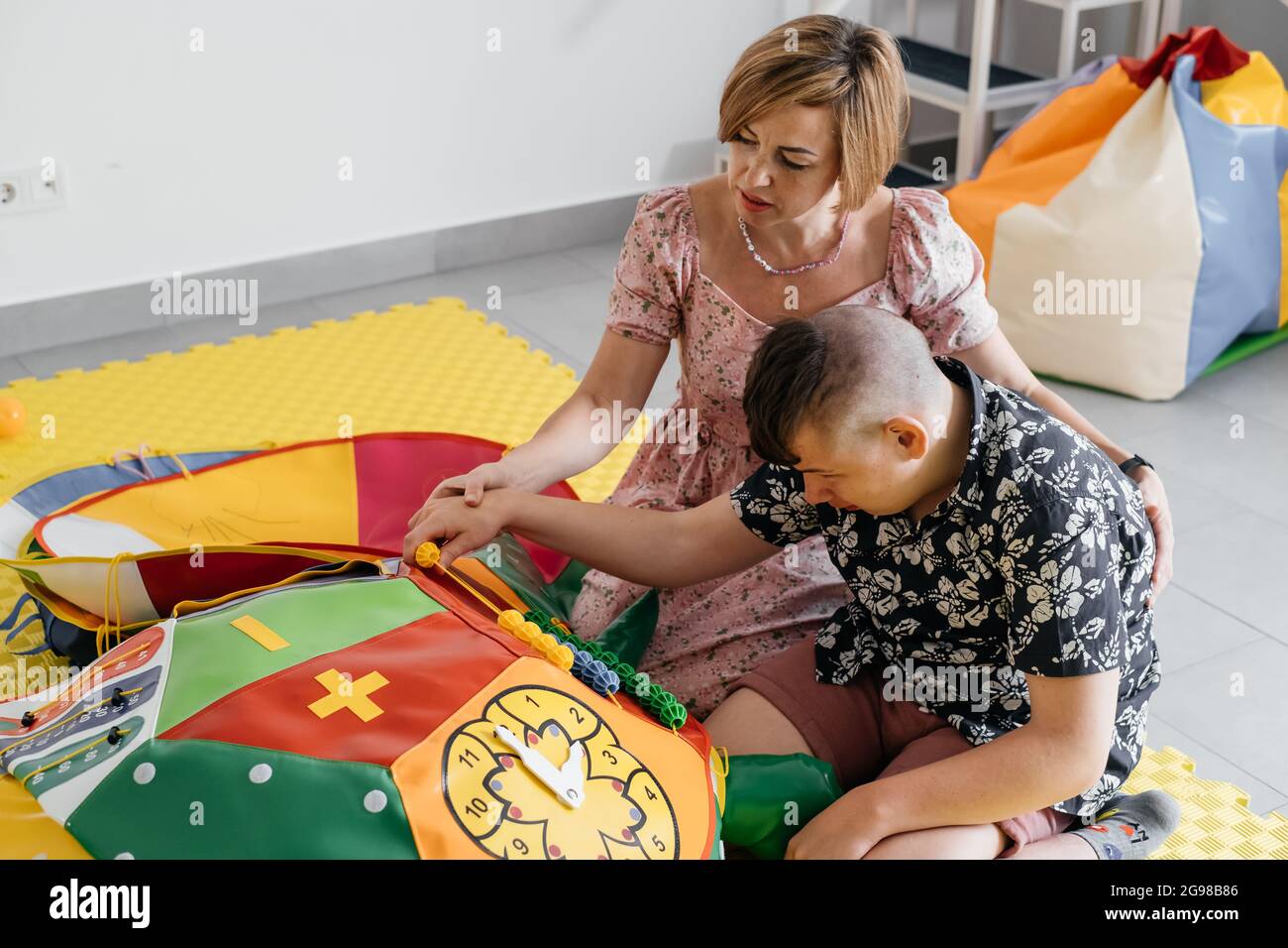 Children with disability getting sensory activity with toys, balls
