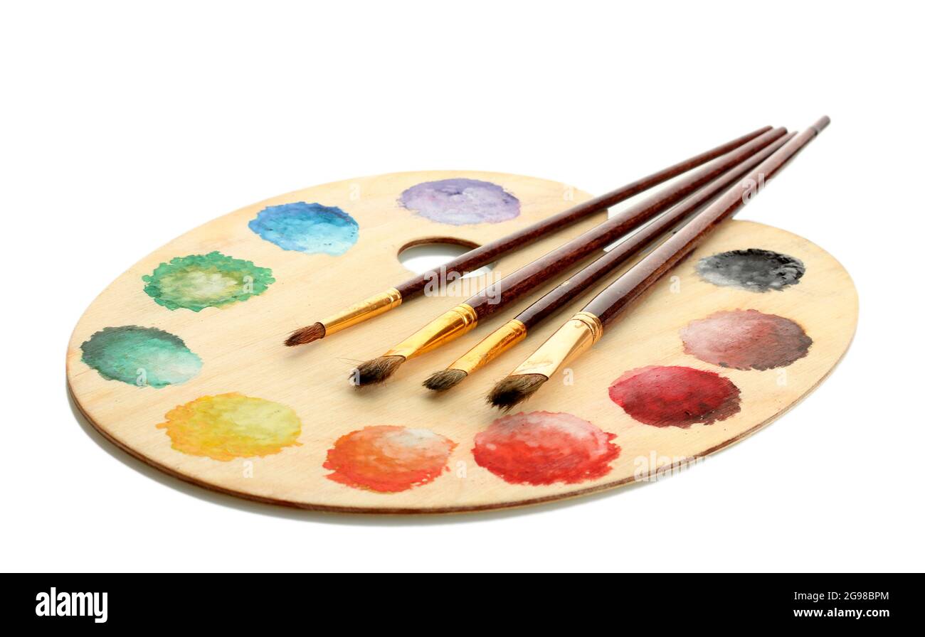 wooden art palette with paint and brushes isolated on white Stock Photo -  Alamy