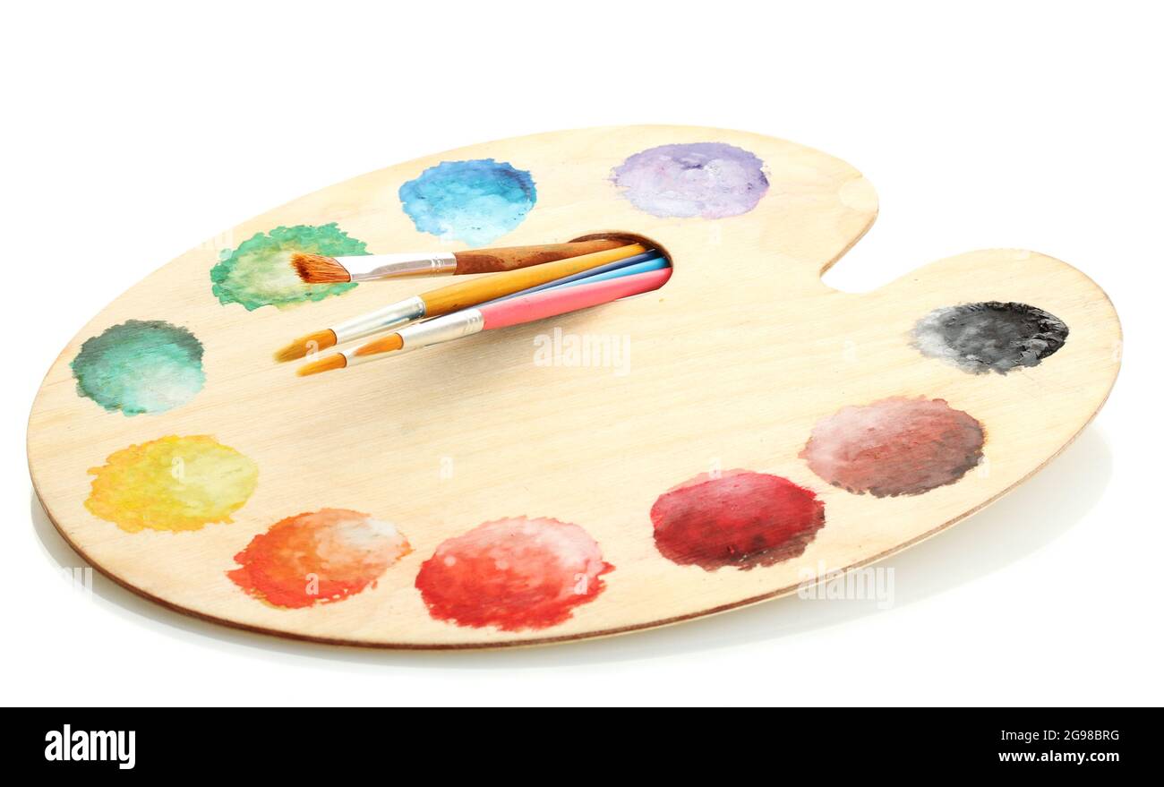 wooden art palette with paint and brushes isolated on white Stock Photo ...