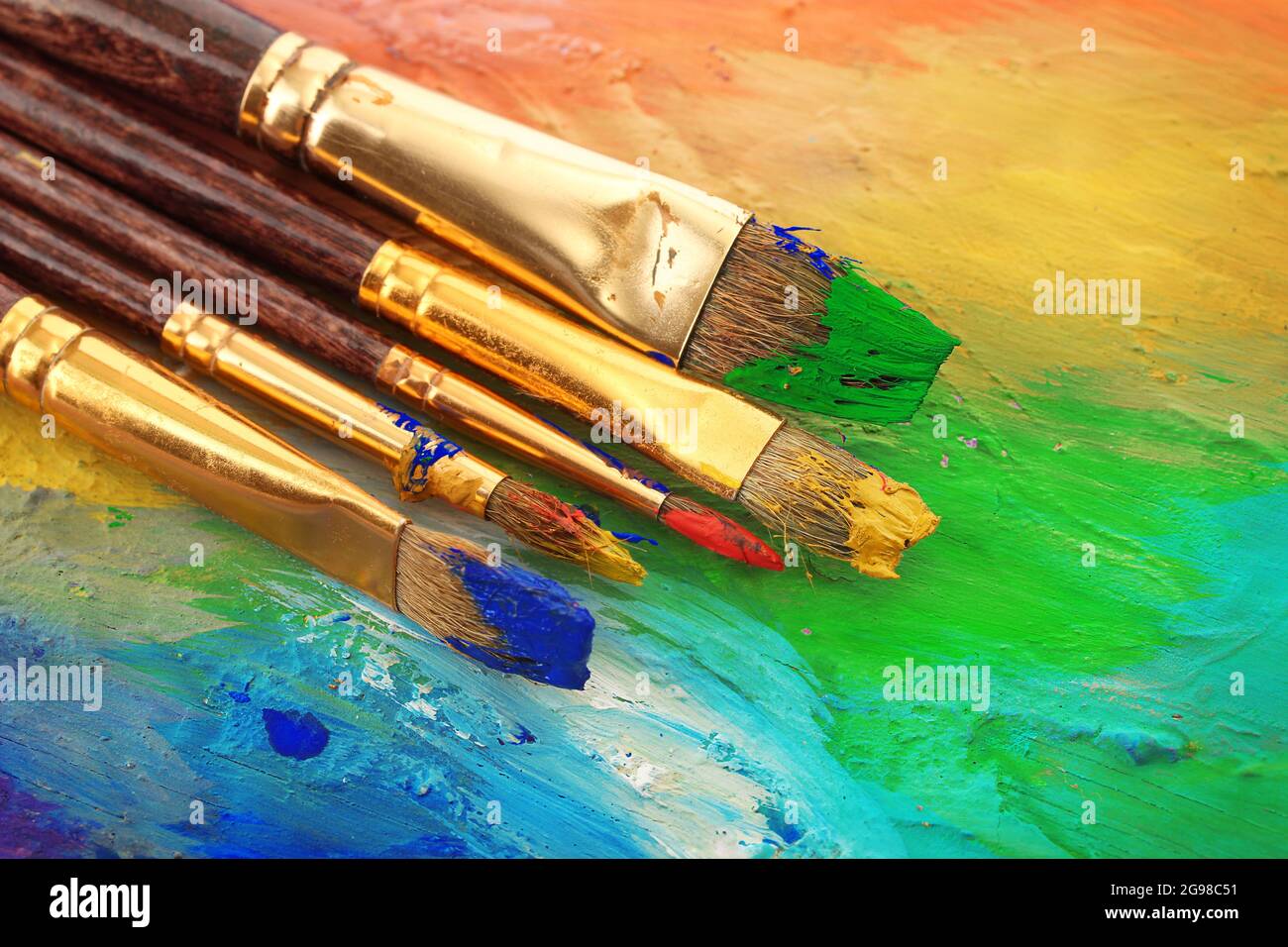 acrylic paint and brushes on wooden palette Stock Photo Alamy