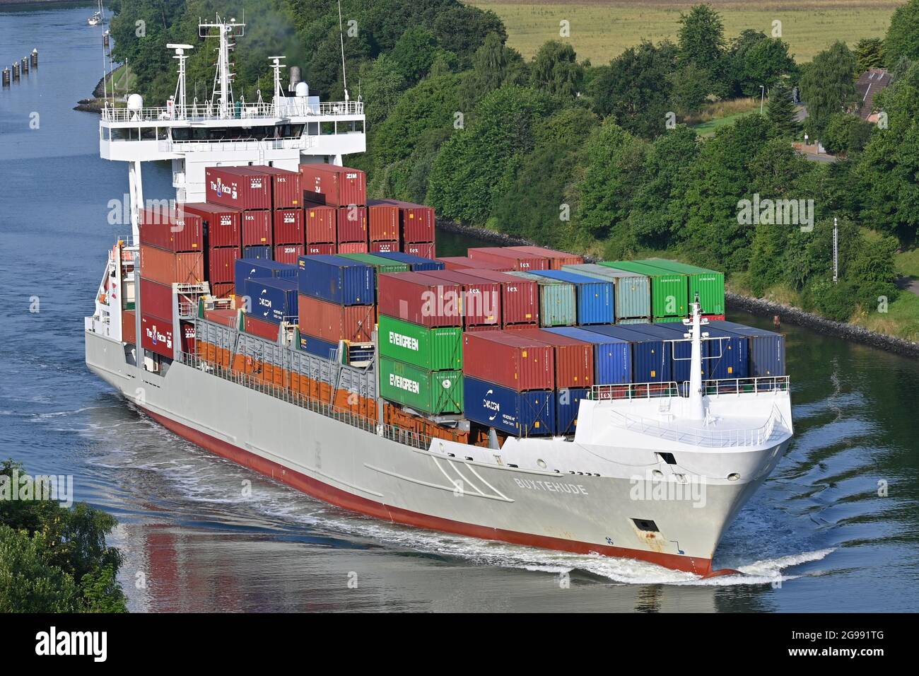 Containership BUXTEHUDE passing the Kiel Canal Stock Photo