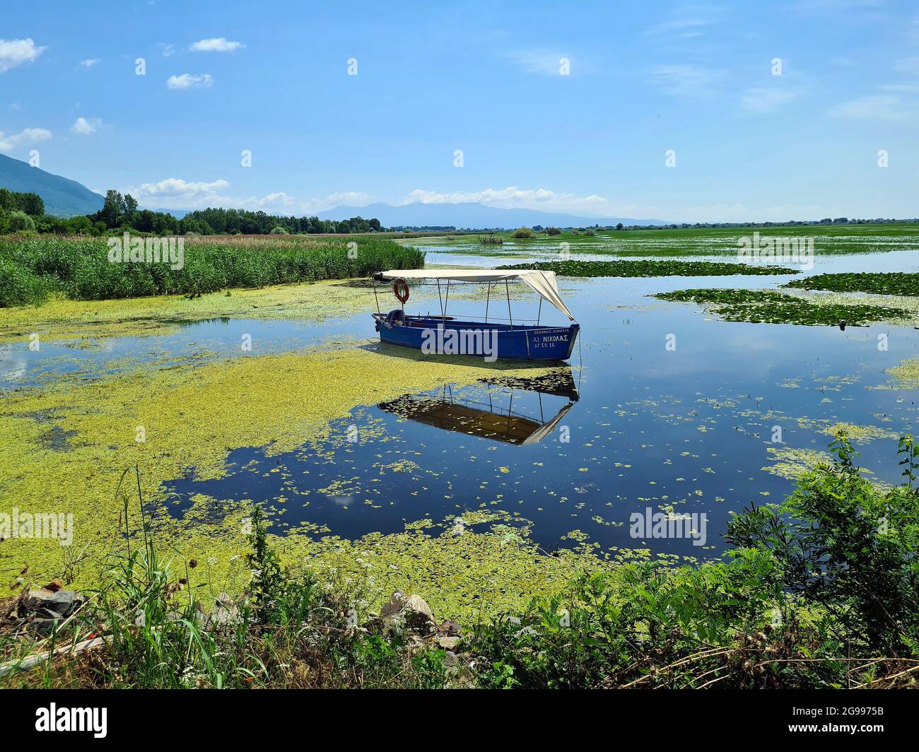 Greece, Landscape with boat on Lake Kerkini in Central Macedonia Stock Photo